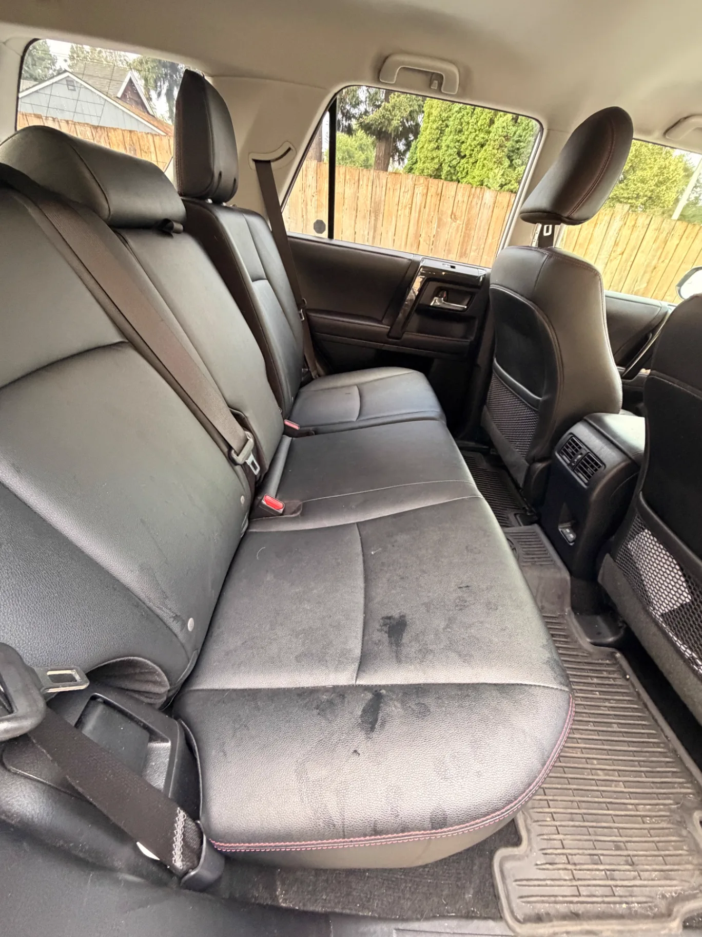 Stained Toyota 4Runner rear seating area before KingWash interior detailing